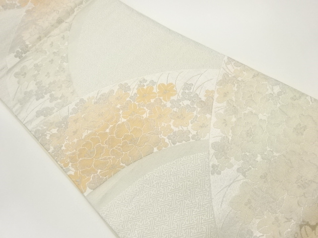 花々に紗綾形・亀甲模様織出し袋帯